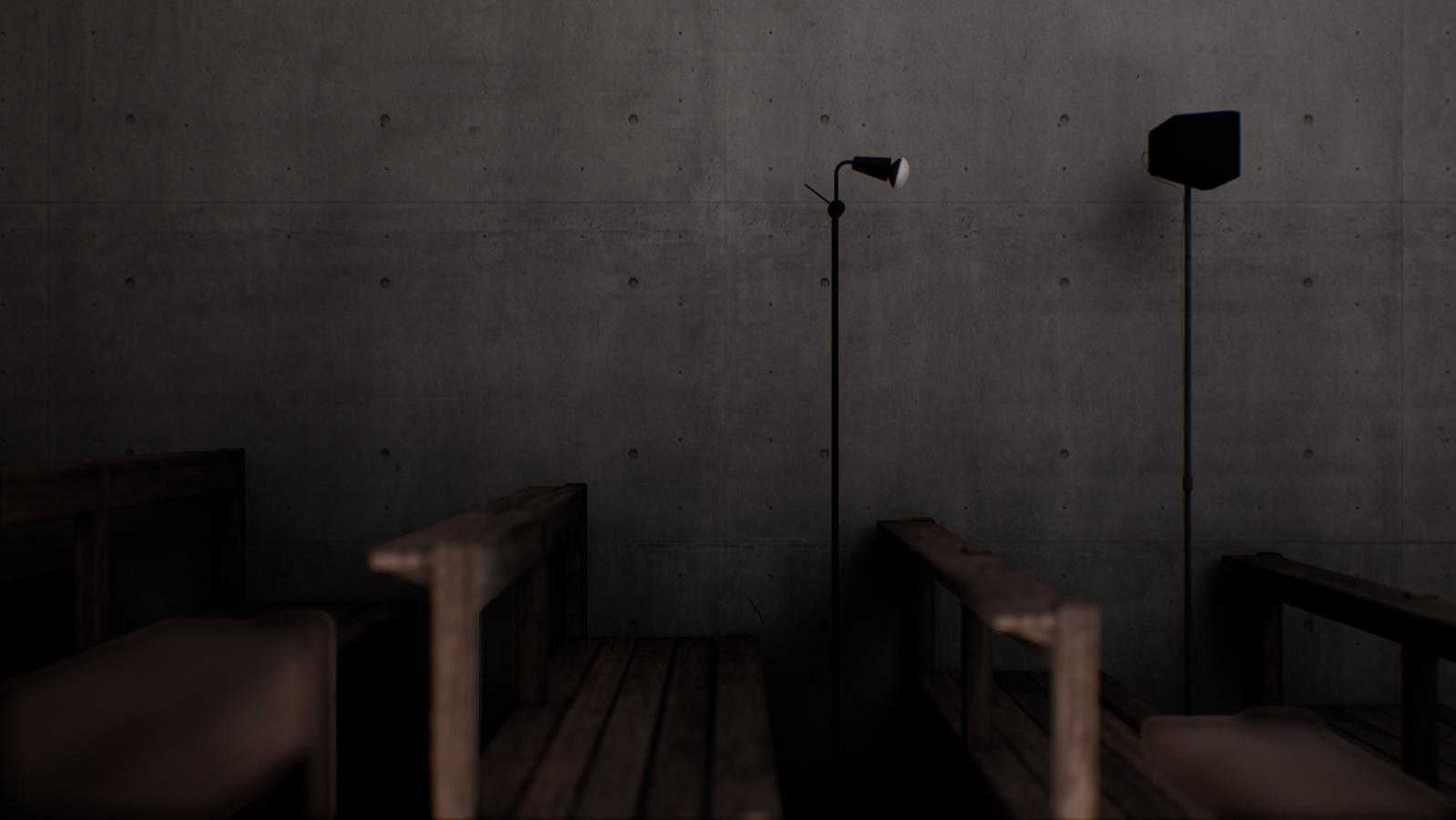 Another photo showing the concrete wall and also the wooden benches